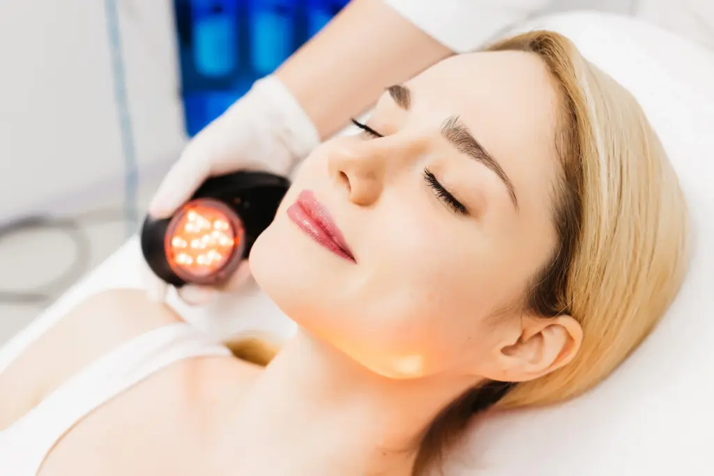 Woman receiving LED light therapy facial treatment | Medical Spa in Corpus Christi, TX | Coastal Glo